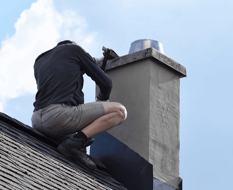 Chimney technician conducting a Level 2 inspection on a Los Angeles home