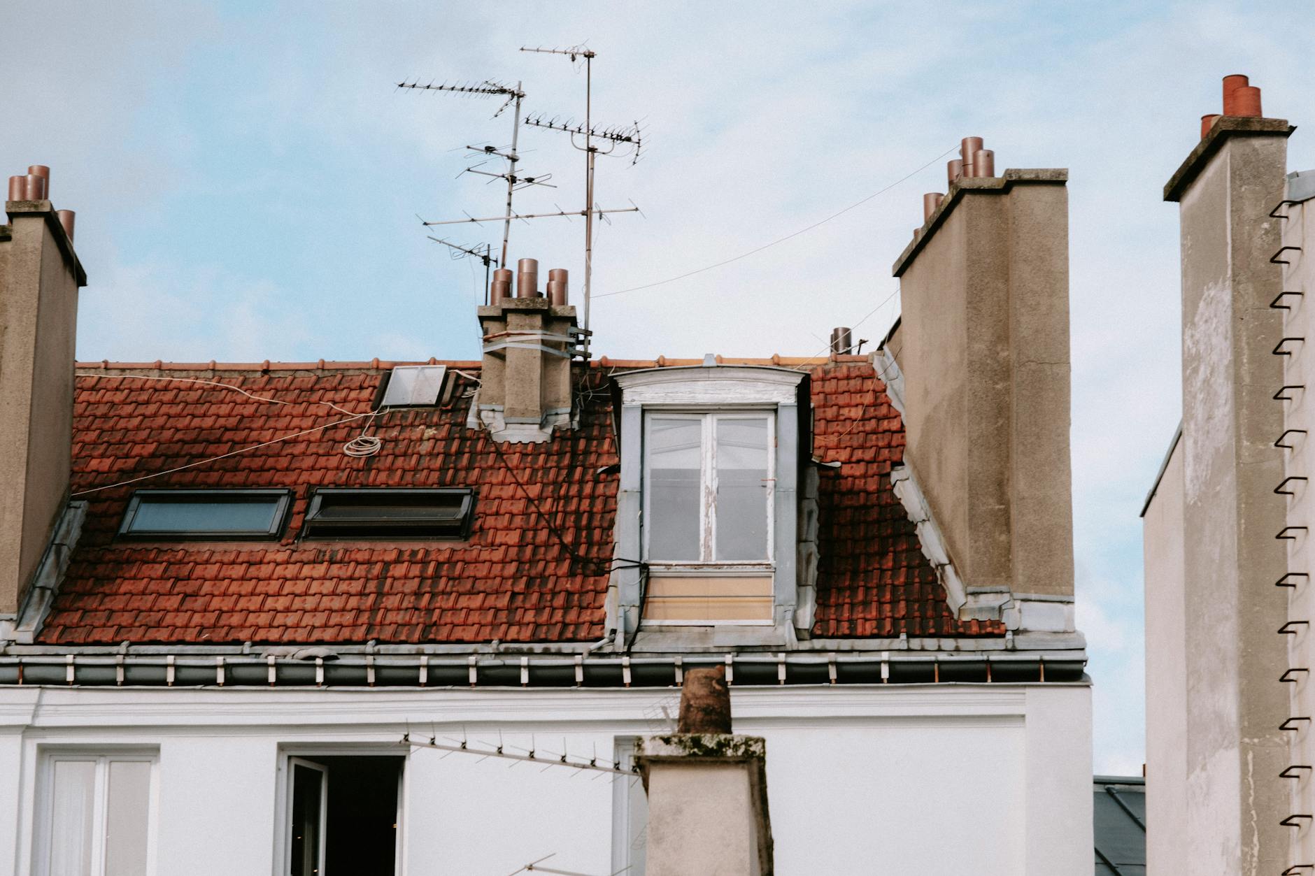 Stainless steel chimney cap installed on rooftop