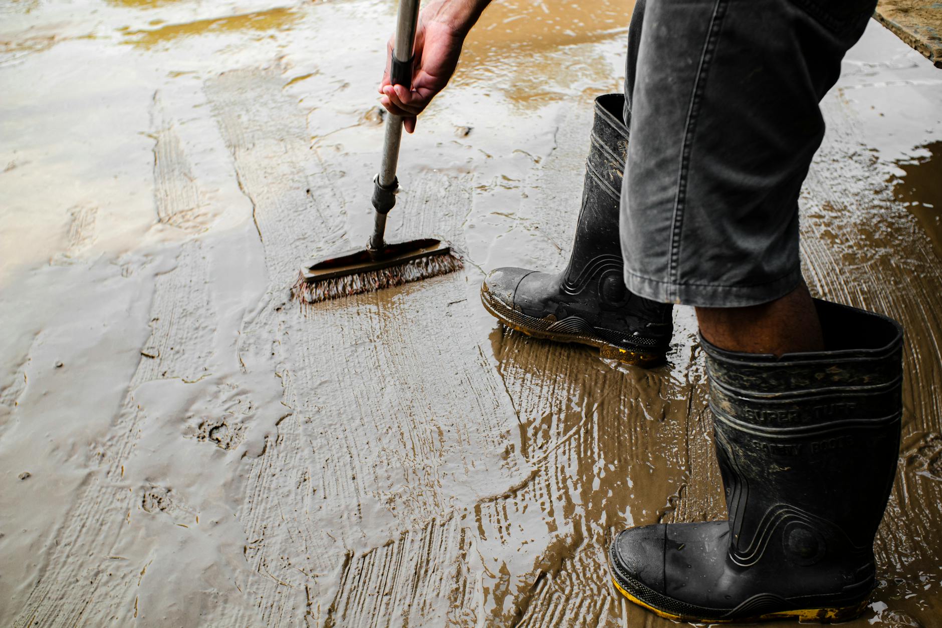 Chimney sweep technician performing a professional cleaning
